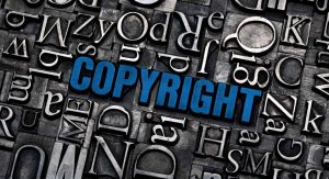the word 'copyright' highlighted in blue, surrounded by letter stamp in times new roman font.