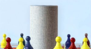 A smart speaker with chess pieces beside it