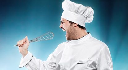Vocal performance tips represented by a chef singing into a whisk that he's pretending is a mic.