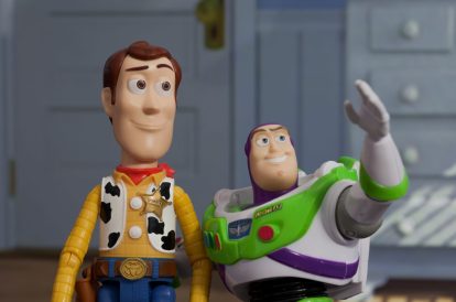 Woody and Buzz from Toy Story look towards the reader.