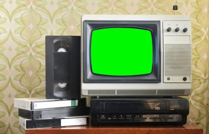 Old silver vintage TV with green screen to add new images to the