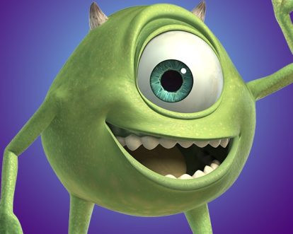 A green monster with one eye smiles and waves towards the camera in front of a purple background.