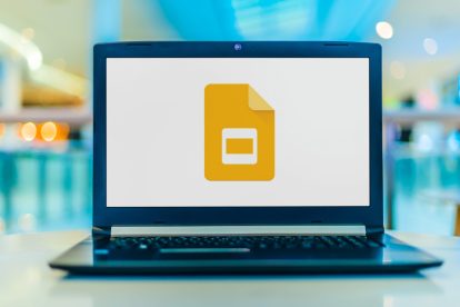 Laptop computer displaying logo of Google Slides