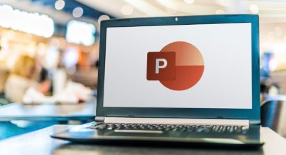 Laptop computer displaying logo of Microsoft PowerPoint for a guide on how to do a voice over on PowerPoint.