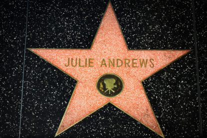Julie Andrews star on the Hollywood Walk of Fame. The Hollywood Walk of Fame is made up of brass stars embedded in the sidewalks on Hollywood Blvd.