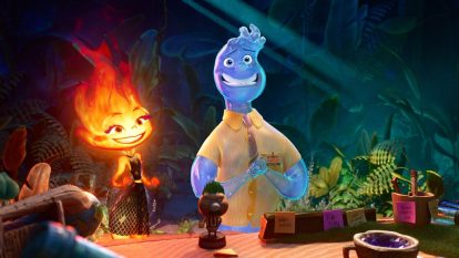 An image from the movie 'Elemental' where a water-based character smiles beside a fire-based character.