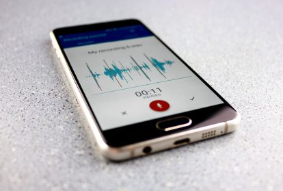 The Voice recorder on a smartphone. Voice recording wave on the screen of a smartphone. Recording sounds on a smartphone. Voice recorder noise level wave.