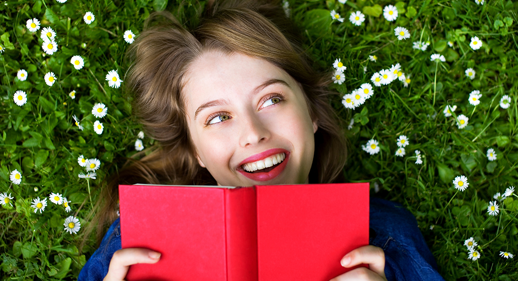A woman excited to read a book