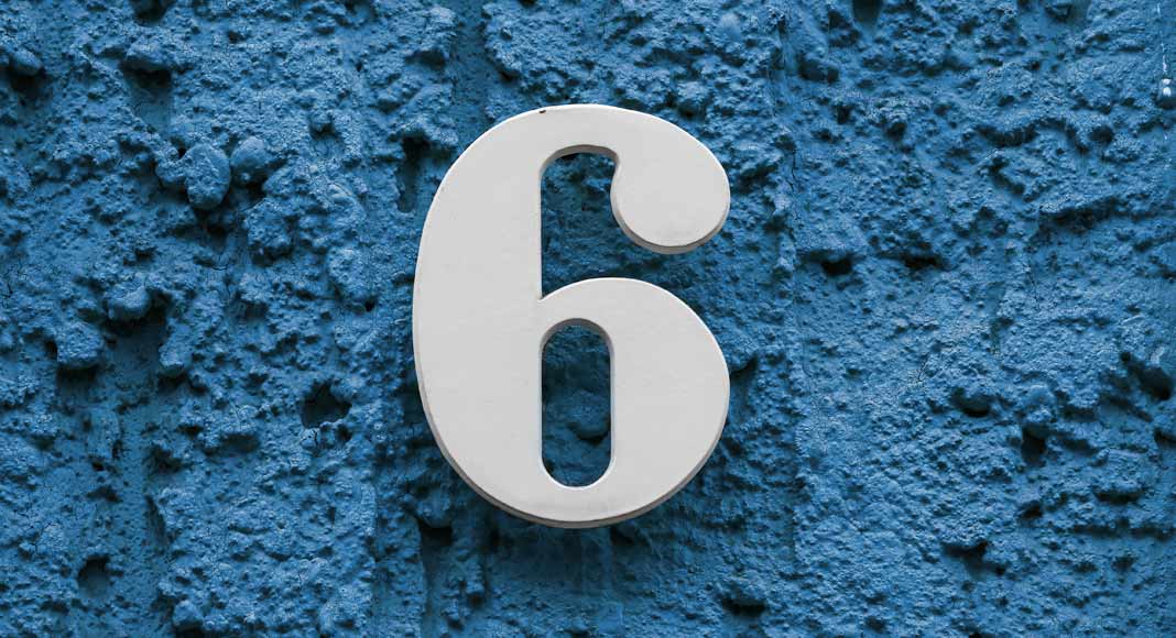 A large number six sits in the middle of a textured blue background.