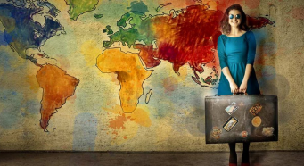 A young woman holding a suitcase, standing in front of a map of the world.