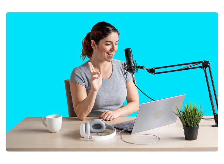 Woman with a microphone and laptop recording